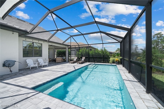 view of pool featuring a lanai and a patio area