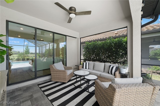 sunroom / solarium with a wealth of natural light and ceiling fan