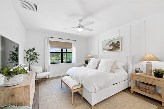 bedroom featuring ceiling fan and hardwood / wood-style floors