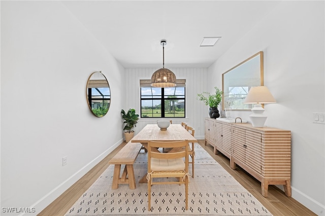 dining area with light hardwood / wood-style floors