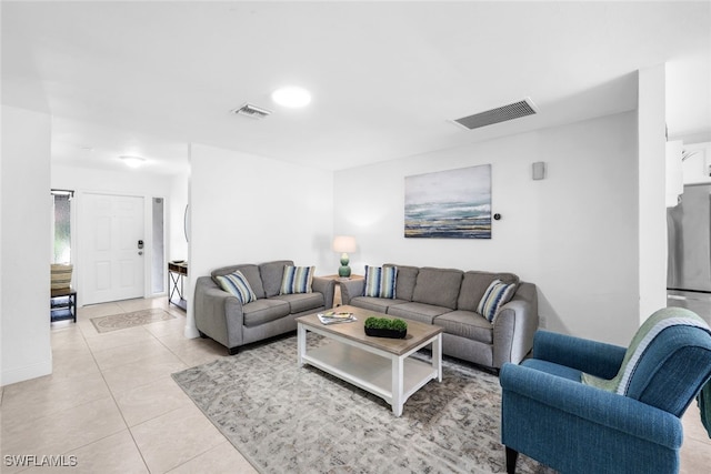 living room with light tile patterned floors