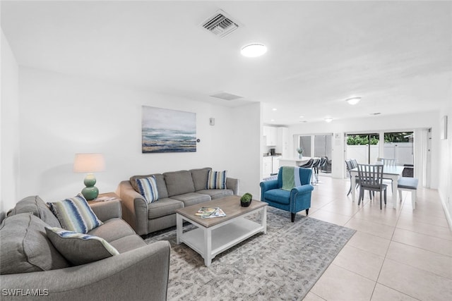 living room with light tile patterned flooring