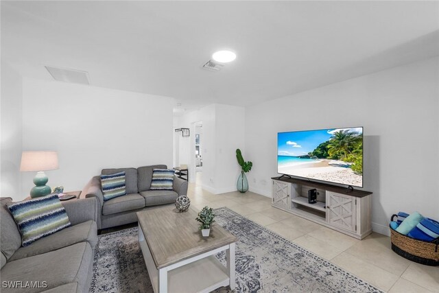 living room with light tile patterned floors