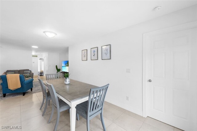 dining room with light tile patterned floors