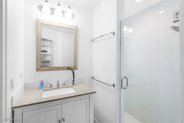 bathroom with vanity and walk in shower