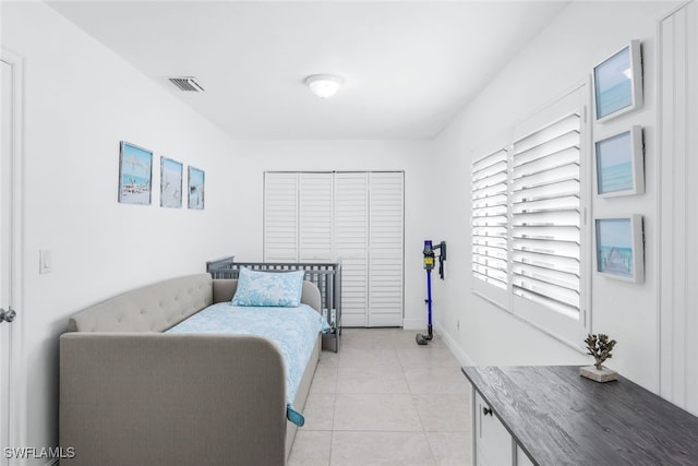 bedroom with light tile patterned flooring