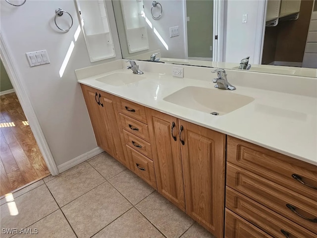 bathroom with tile patterned flooring and vanity