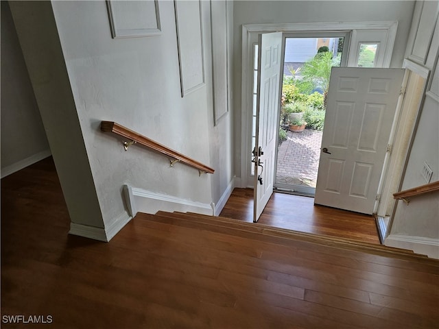 entrance foyer with dark hardwood / wood-style flooring