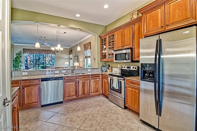 kitchen featuring a healthy amount of sunlight, appliances with stainless steel finishes, kitchen peninsula, and sink