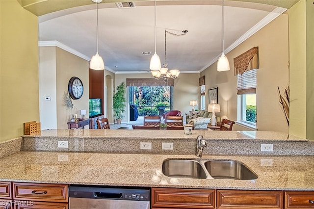 kitchen with decorative light fixtures, dishwasher, light stone counters, and sink