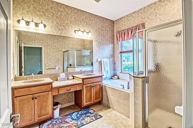 bathroom with vanity, tile patterned floors, and plus walk in shower