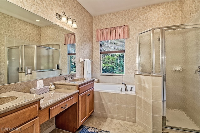 bathroom featuring vanity, separate shower and tub, and tile patterned floors