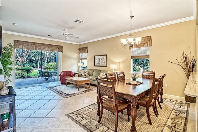 dining space featuring ceiling fan with notable chandelier, crown molding, and light tile patterned flooring