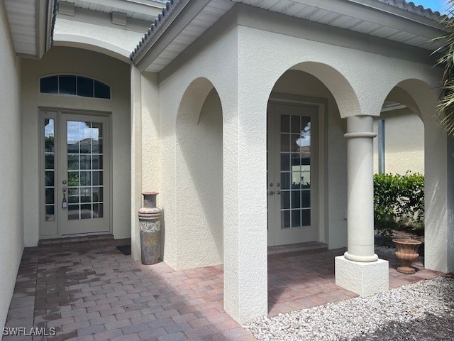 entrance to property featuring french doors