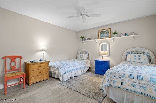 bedroom featuring ceiling fan and light hardwood / wood-style floors