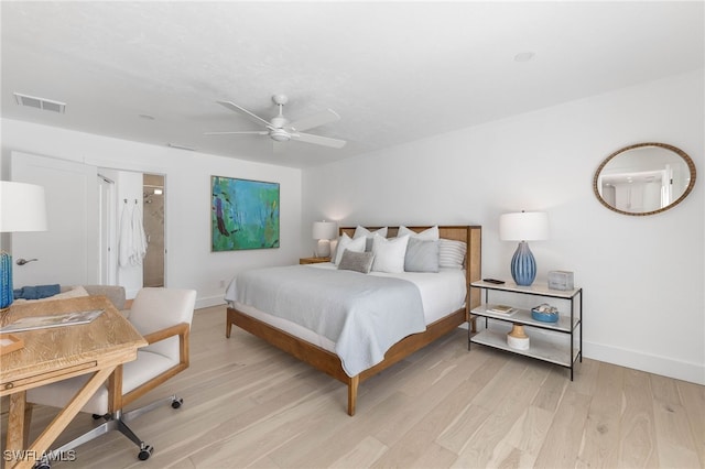 bedroom with light hardwood / wood-style floors and ceiling fan