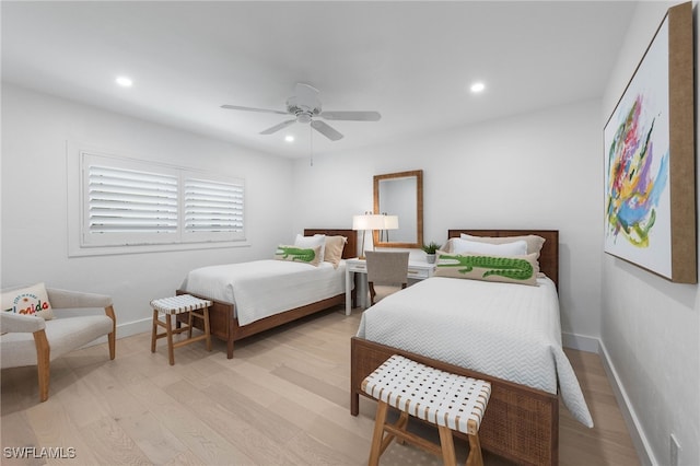 bedroom with ceiling fan and light wood-type flooring