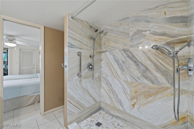 bathroom featuring ceiling fan, tile patterned floors, and tiled shower