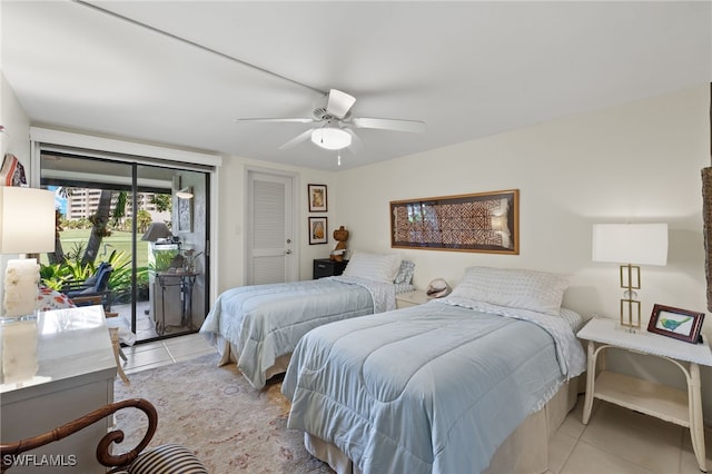 bedroom featuring light tile patterned flooring, ceiling fan, and access to exterior