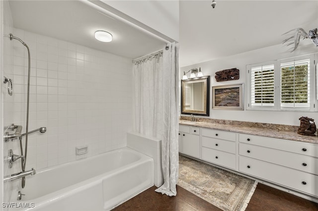 bathroom featuring vanity and shower / bathtub combination with curtain