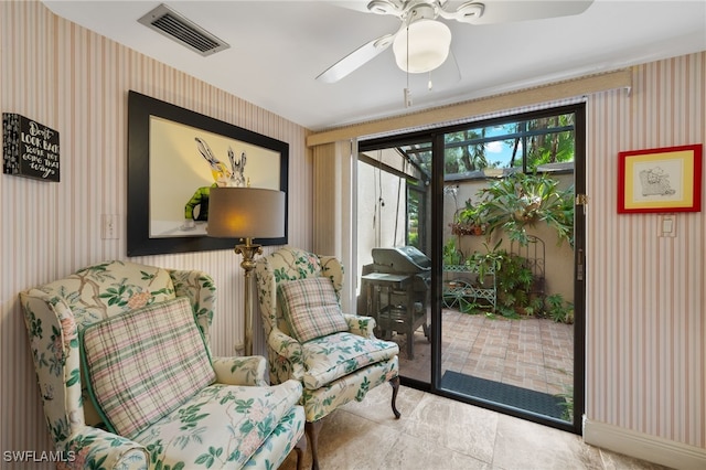 entryway featuring ceiling fan and tile patterned floors