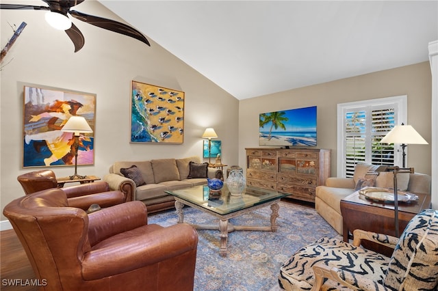 living room featuring hardwood / wood-style flooring, vaulted ceiling, and ceiling fan