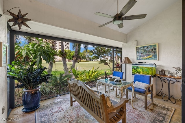 sunroom / solarium featuring ceiling fan and vaulted ceiling