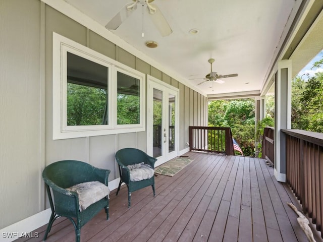 deck with french doors and ceiling fan