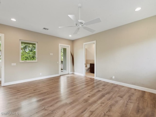 spare room featuring recessed lighting, a ceiling fan, light wood-style floors, visible vents, and baseboards