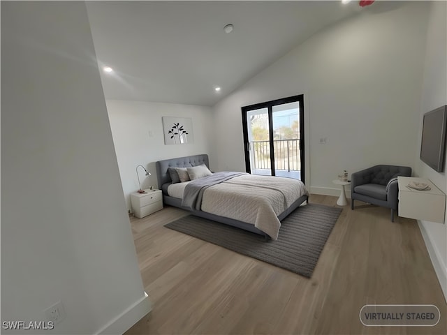 bedroom with access to outside, light hardwood / wood-style floors, and vaulted ceiling