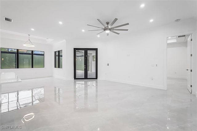 empty room featuring ceiling fan, a healthy amount of sunlight, and light tile patterned floors