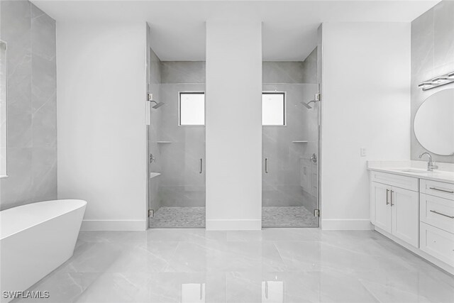 bathroom with vanity, walk in shower, and tile patterned floors