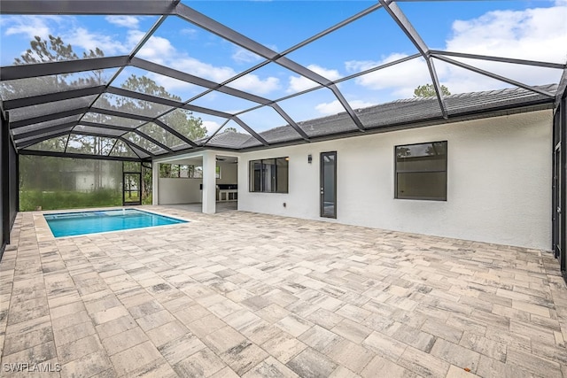 view of swimming pool with a patio and a lanai