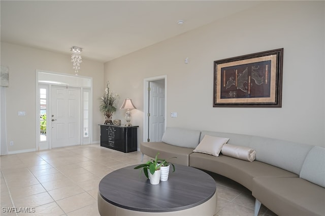 living room featuring baseboards and light tile patterned floors