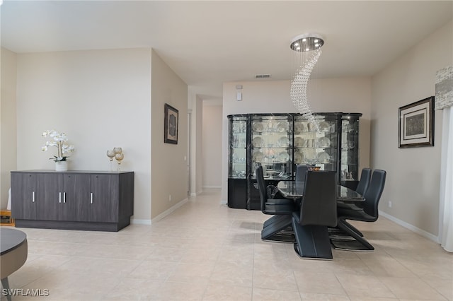 dining area featuring visible vents, baseboards, and light tile patterned floors