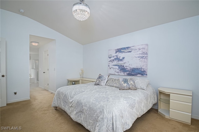 bedroom featuring a chandelier, light colored carpet, vaulted ceiling, and baseboards