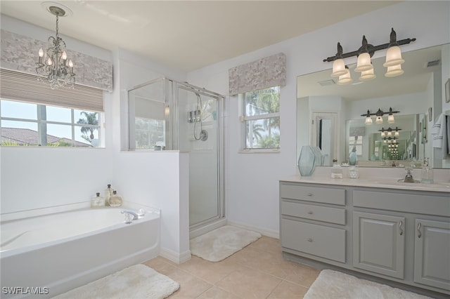 bathroom featuring a notable chandelier, visible vents, a shower stall, vanity, and tile patterned flooring