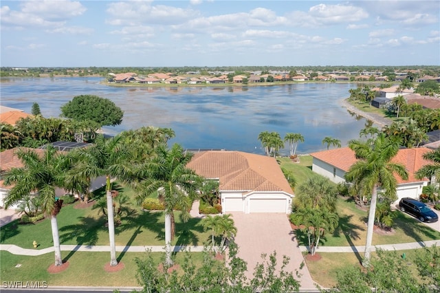 birds eye view of property featuring a water view and a residential view