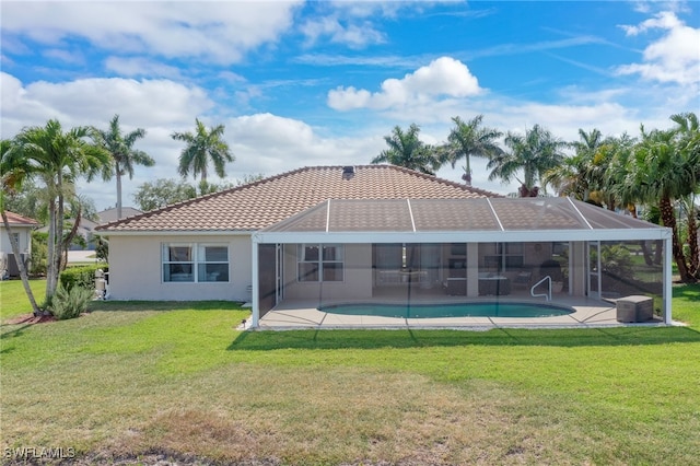 back of house featuring an outdoor pool, a lanai, a yard, and a patio