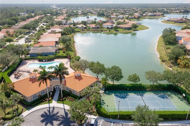 drone / aerial view with a water view and a residential view