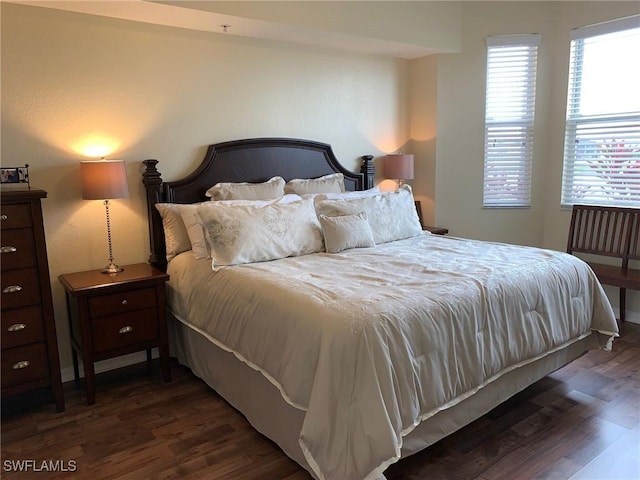 bedroom featuring dark wood-style flooring