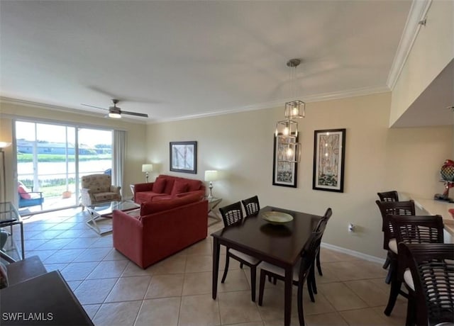 dining area featuring baseboards, ceiling fan, light tile patterned flooring, and crown molding