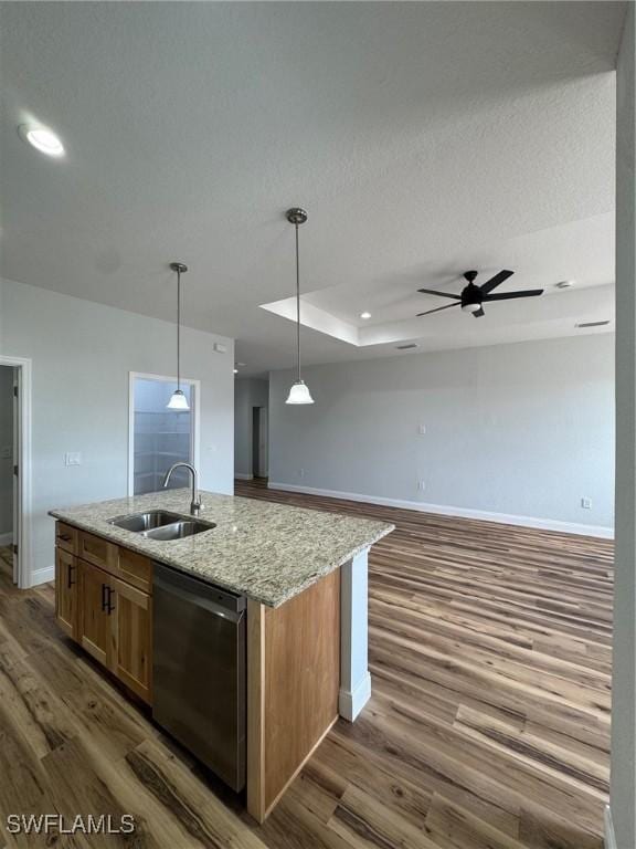 kitchen with a sink, dark wood-style flooring, a center island with sink, baseboards, and stainless steel dishwasher