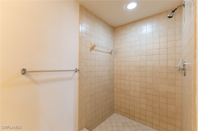 bathroom with tiled shower