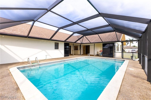 view of pool featuring a lanai and a patio area