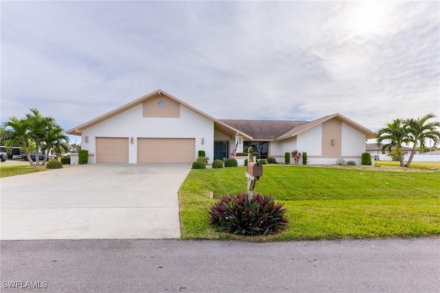 single story home with a front yard and a garage