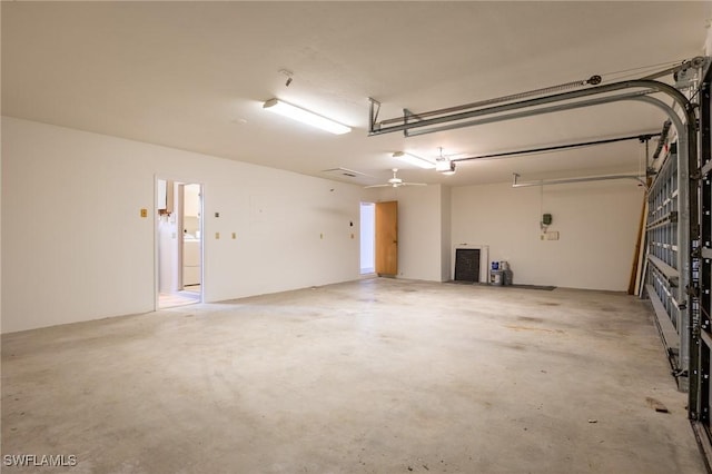 garage with ceiling fan, washer / clothes dryer, and a garage door opener