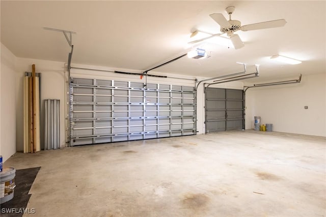 garage with a garage door opener and ceiling fan