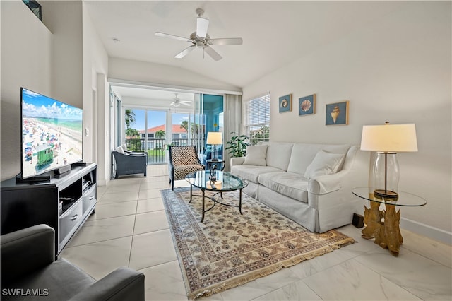 living room featuring ceiling fan and lofted ceiling