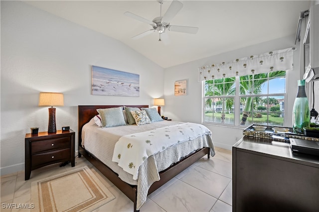 bedroom featuring ceiling fan and lofted ceiling